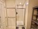 Modern bathroom featuring an enclosed glass shower, towel rack, and tiled floors at 300 W 11Th Ave # 10D, Denver, CO 80204