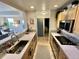 Galley kitchen with updated appliances, mosaic tile backsplash, and an open view to the living area at 300 W 11Th Ave # 10D, Denver, CO 80204