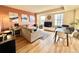 Comfortable living room featuring hardwood floors, a large sectional, and windows for natural light at 300 W 11Th Ave # 10D, Denver, CO 80204
