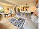 Bright living room and dining area with wood floors and an open layout to the kitchen at 300 W 11Th Ave # 10D, Denver, CO 80204