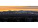Breathtaking mountain view at sunrise with orange sky and snow-capped peaks, offering a serene backdrop at 300 W 11Th Ave # 10D, Denver, CO 80204