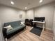 Flex room set up as an office with a futon, desk, and modern furnishings at 300 W 11Th Ave # 10D, Denver, CO 80204