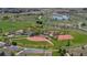 The aerial view shows nearby recreational area with ball fields, playground, and pond at 11374 Xavier Dr # 202, Westminster, CO 80031