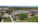 Stunning aerial view of a two-story home with lush landscaping and mountain views on a sunny day at 11374 Xavier Dr # 202, Westminster, CO 80031