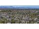 Majestic aerial view displays homes with a breathtaking mountain range in the background at 11374 Xavier Dr # 202, Westminster, CO 80031