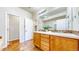 Bathroom boasts double vanity, and tile flooring with warm lighting at 11374 Xavier Dr # 202, Westminster, CO 80031