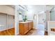 Bathroom boasts double vanity, and tile flooring with warm lighting with walk-in closet at 11374 Xavier Dr # 202, Westminster, CO 80031