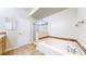 Bright bathroom featuring a soaking tub, tiled accents and a glass-enclosed shower at 11374 Xavier Dr # 202, Westminster, CO 80031