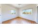 This bedroom has two windows which illuminate the hardwood flooring and fill the room with natural light at 11374 Xavier Dr # 202, Westminster, CO 80031