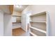 Organized walk-in closet with shelving and hanging rods for ample storage at 11374 Xavier Dr # 202, Westminster, CO 80031