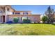 Well-maintained lawn and exterior showcasing the building's brick and siding at 11374 Xavier Dr # 202, Westminster, CO 80031