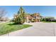 A wide view of the townhome's exterior, featuring a well-kept lawn and garages at 11374 Xavier Dr # 202, Westminster, CO 80031