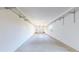 A spacious garage with concrete flooring and wire shelving around the perimeter at 11374 Xavier Dr # 202, Westminster, CO 80031