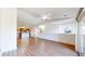 Bright living room with hardwood floors, a ceiling fan, and a view of the kitchen at 11374 Xavier Dr # 202, Westminster, CO 80031