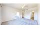 Large bedroom with a ceiling fan and plush carpeting creating a cozy retreat at 11374 Xavier Dr # 202, Westminster, CO 80031