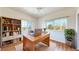 Bright home office with a large window, built-in shelving, and a stylish desk at 11374 Xavier Dr # 202, Westminster, CO 80031