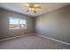 Spacious bedroom with carpeted floors and a ceiling fan at 23541 E Portland Way, Aurora, CO 80016