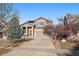 Two-story house with a driveway and landscaping at 23541 E Portland Way, Aurora, CO 80016