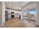 Modern kitchen with white cabinets, stainless steel appliances and island at 23541 E Portland Way, Aurora, CO 80016