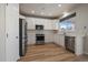 Modern kitchen with white cabinets and stainless steel appliances at 23541 E Portland Way, Aurora, CO 80016