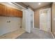 Laundry room with cabinets and access to a bathroom at 23541 E Portland Way, Aurora, CO 80016