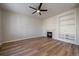 Spacious living room with a fireplace, built-in shelving, and vinyl flooring at 23541 E Portland Way, Aurora, CO 80016