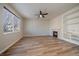 Spacious living room with a fireplace, built-in shelving, and vinyl flooring at 23541 E Portland Way, Aurora, CO 80016