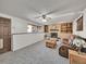 Finished basement with fireplace, built-in shelving, and lots of natural light at 2066 S Rifle St, Aurora, CO 80013