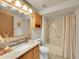 Clean bathroom with granite countertop and bathtub/shower combo at 2066 S Rifle St, Aurora, CO 80013