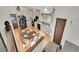 Open kitchen with black appliances and a view from the upper level at 2066 S Rifle St, Aurora, CO 80013