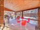 Covered patio with seating area and gas grill, ideal for outdoor dining at 2066 S Rifle St, Aurora, CO 80013