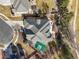 Bird's-eye view of a home with a basketball court, landscaping, and a unique roof design at 26426 E Peakview Dr, Aurora, CO 80016