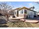 Exterior of home featuring patio, fire pit, and landscaped yard at 26426 E Peakview Dr, Aurora, CO 80016