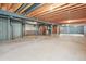 Unfinished basement with exposed beams, concrete walls, and visible utilities for a customizable space at 26426 E Peakview Dr, Aurora, CO 80016