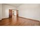 Spacious room featuring hardwood floors and double doors at 26426 E Peakview Dr, Aurora, CO 80016