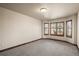 Bedroom features carpeted floor and windows with wood trim and shutter blinds at 26426 E Peakview Dr, Aurora, CO 80016