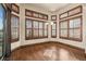 Sun-filled dining area features hardwood floors, large windows, and stylish lighting at 26426 E Peakview Dr, Aurora, CO 80016