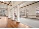 Spacious living room with decorative columns and natural light at 26426 E Peakview Dr, Aurora, CO 80016