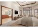 Main bedroom leading to a bathroom with a soaking tub, vanity, and large windows at 26426 E Peakview Dr, Aurora, CO 80016