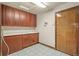 Mud room with tiled floor, cabinets and sink at 26426 E Peakview Dr, Aurora, CO 80016