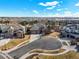 Street view of homes in a suburban neighborhood with well-maintained lawns and mature trees at 26426 E Peakview Dr, Aurora, CO 80016