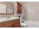 Bathroom including a shower, sink, toilet, and medicine cabinet at 1745 S Kline Way, Lakewood, CO 80232