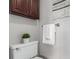 Bathroom with towels, decor, and overhead cabinets at 1745 S Kline Way, Lakewood, CO 80232