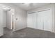 Bedroom with closet and entrance to bathroom at 1745 S Kline Way, Lakewood, CO 80232