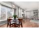 Dining area features a window, chandelier, and hardwood floors at 1745 S Kline Way, Lakewood, CO 80232