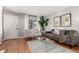 Cozy living room showcasing neutral tones, hardwood floors, and stylish decor at 1745 S Kline Way, Lakewood, CO 80232