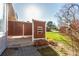 Outdoor patio featuring a privacy fence, brick pavers, and a view of the surrounding yard at 1745 S Kline Way, Lakewood, CO 80232