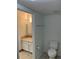 Cozy bathroom featuring neutral tile floors, a modern vanity, and a standard toilet at 10369 E Red Mtn, Littleton, CO 80127