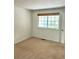 Bedroom with neutral carpet, a double-hung window, and fresh, white walls at 10369 E Red Mtn, Littleton, CO 80127