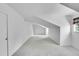 This room is all white with carpet and window at 10369 E Red Mtn, Littleton, CO 80127
